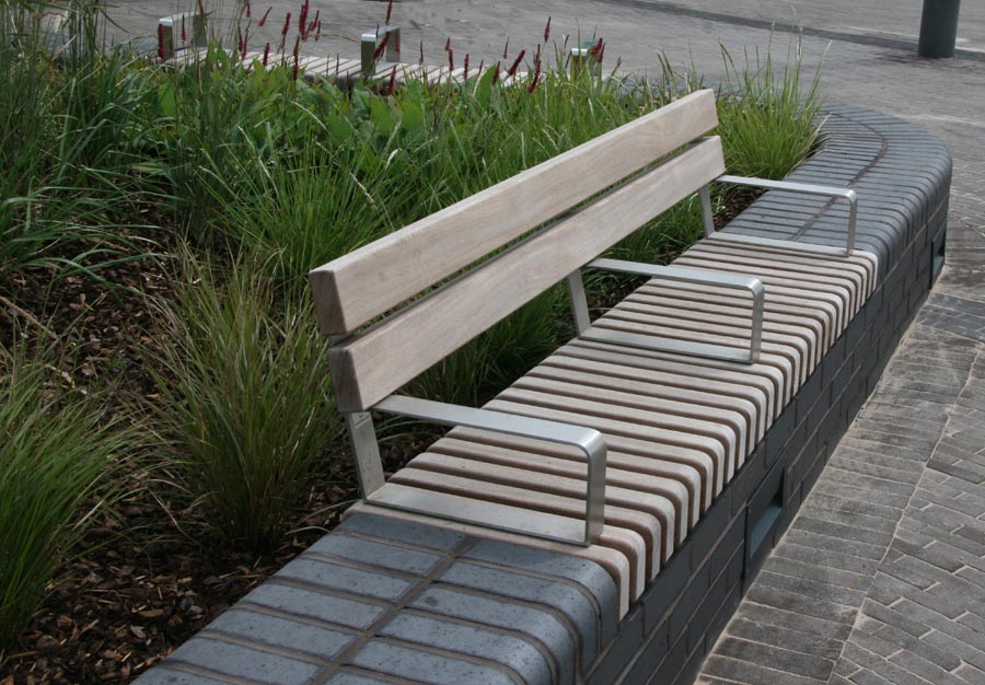 bespoke tapered special bullnose bricks with timber benches at Wichelstowe Canalside